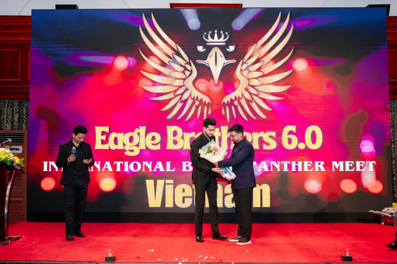 Moksh participating on stage at a business event